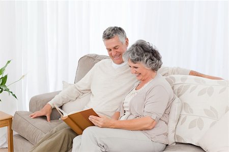 simsearch:400-04311095,k - Senior couple looking at their photo album at home Stock Photo - Budget Royalty-Free & Subscription, Code: 400-04318694