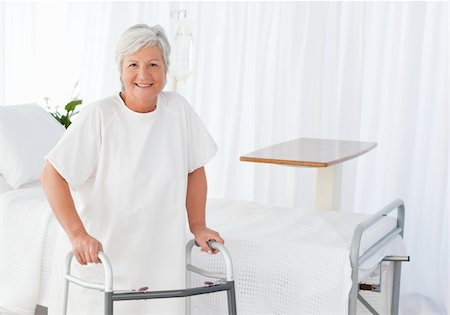 simsearch:400-04549195,k - Senior woman looking at the camera with her zimmer frame Stock Photo - Budget Royalty-Free & Subscription, Code: 400-04318733