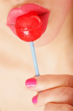 simsearch:400-07568470,k - close-up of a red lollipop on pink lips Stockbilder - Microstock & Abonnement, Bildnummer: 400-04318789