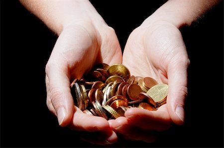 simsearch:400-07123052,k - hands with money coins on a black background Stock Photo - Budget Royalty-Free & Subscription, Code: 400-04318953