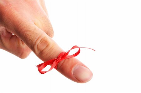 red bow on male finger showing reminder or dont forget concept in white Fotografie stock - Microstock e Abbonamento, Codice: 400-04319018