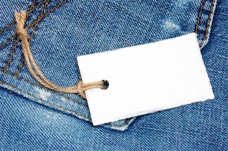 simsearch:400-04758693,k - blank price tag with copyspace on a jeans texture Photographie de stock - Aubaine LD & Abonnement, Code: 400-04319042