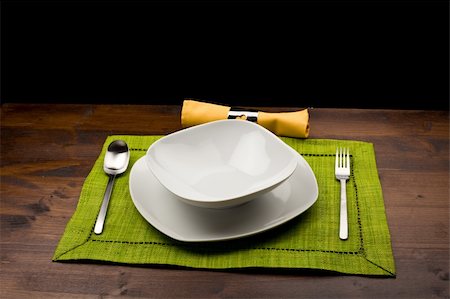 photo of wood table with dishes which is ready to be seated for lunch Foto de stock - Super Valor sin royalties y Suscripción, Código: 400-04319072