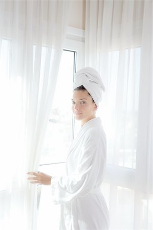 Bathrobe happy woman sunny hotel window white curtains Stock Photo - Budget Royalty-Free & Subscription, Code: 400-04319290