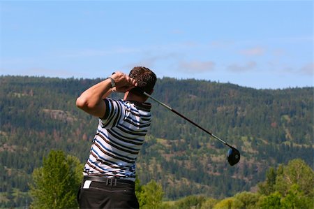 simsearch:400-03997921,k - Young golfer following his ball after teeing off Stock Photo - Budget Royalty-Free & Subscription, Code: 400-04319375