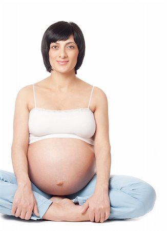 simsearch:400-06849973,k - Sitting smiling pregnant woman isolated over white background Stock Photo - Budget Royalty-Free & Subscription, Code: 400-04319451