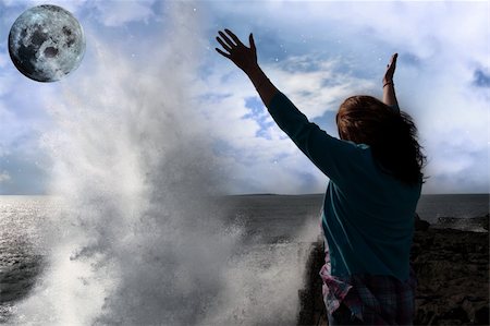 simsearch:400-04662543,k - a lone woman raising her arms in awe at the powerful wave and full moon on the cliffs edge in county clare ireland Stock Photo - Budget Royalty-Free & Subscription, Code: 400-04319484