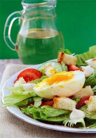 salad with fresh vegetables, tomatoes and eggs on a plate Stock Photo - Budget Royalty-Free & Subscription, Code: 400-04319556