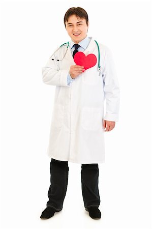 simsearch:400-04351236,k - Smiling medical doctor holding paper heart near  chest  isolated on white Photographie de stock - Aubaine LD & Abonnement, Code: 400-04319731