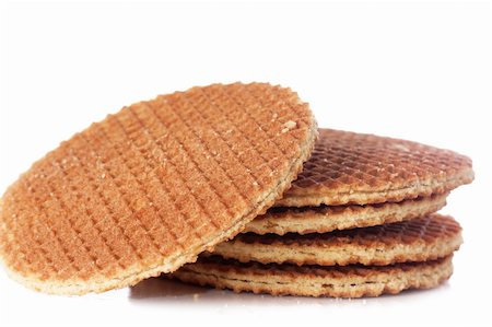 A stack of golden round waffles isolated over white background. Stock Photo - Budget Royalty-Free & Subscription, Code: 400-04319835