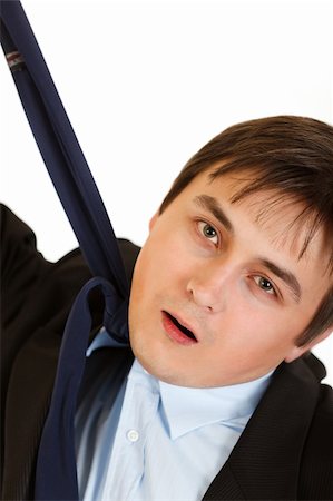 simsearch:400-05687698,k - Stressed businessman hanging himself on his necktie isolated on white Stock Photo - Budget Royalty-Free & Subscription, Code: 400-04310230