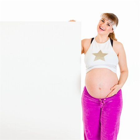 simsearch:400-04798379,k - Happy beautiful pregnant woman holding blank billboard  isolated on white Foto de stock - Super Valor sin royalties y Suscripción, Código: 400-04310619