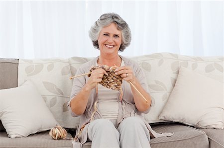 Retired woman knitting at home Stock Photo - Budget Royalty-Free & Subscription, Code: 400-04310998