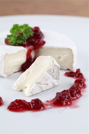 simsearch:400-06741554,k - Camembert with cranberry jam and parsley on white plate. Shallow dof Foto de stock - Royalty-Free Super Valor e Assinatura, Número: 400-04311018