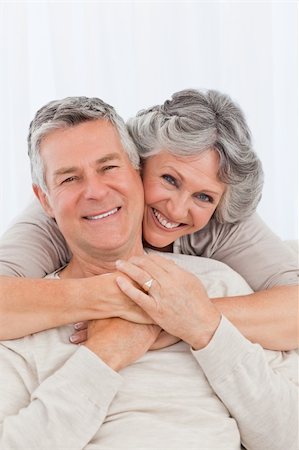 Mature couple looking at the camera at home Stock Photo - Budget Royalty-Free & Subscription, Code: 400-04311038