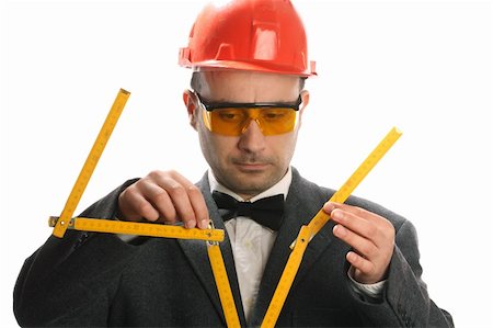 simsearch:400-04616755,k - Portrait of stupid engineer with yard measure Stock Photo - Budget Royalty-Free & Subscription, Code: 400-04311071