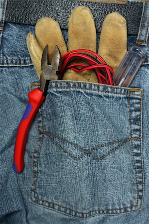 stitching tools - tools in the back pocket of jeans Stock Photo - Budget Royalty-Free & Subscription, Code: 400-04311073