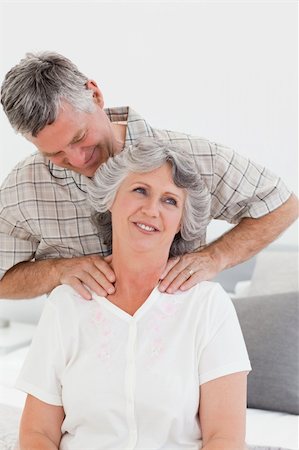 simsearch:400-04311095,k - Retired man giving a massage to his wife at home Stock Photo - Budget Royalty-Free & Subscription, Code: 400-04311102