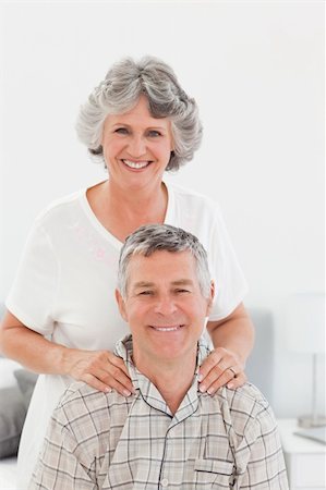 Retired woman giving a massage to her husband at home Stock Photo - Budget Royalty-Free & Subscription, Code: 400-04311113
