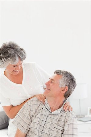 Retired woman giving a massage to her husband at home Stock Photo - Budget Royalty-Free & Subscription, Code: 400-04311120