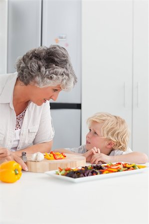 simsearch:400-04306457,k - Little boy looking at his grandmother cooking at home Stock Photo - Budget Royalty-Free & Subscription, Code: 400-04311186