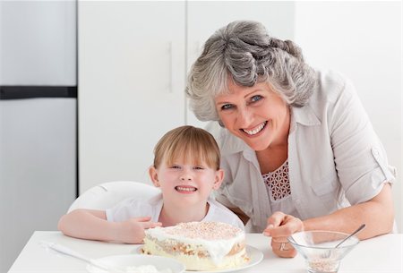 rolling over - Lovely girl and her grandmother looking at the camera Stock Photo - Budget Royalty-Free & Subscription, Code: 400-04311195