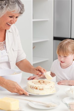 rolling over - Girl baking with her grandmother at home Stock Photo - Budget Royalty-Free & Subscription, Code: 400-04311191