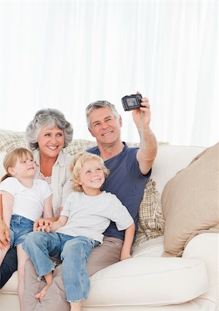 Family taking a photo of themselves at home Stock Photo - Budget Royalty-Free & Subscription, Code: 400-04311217