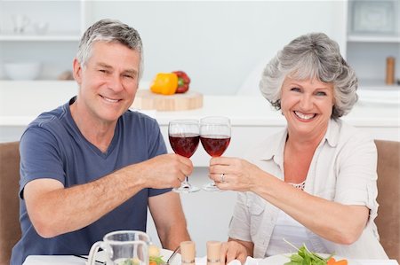 Senior couple drinking some wine at home Stock Photo - Budget Royalty-Free & Subscription, Code: 400-04311237
