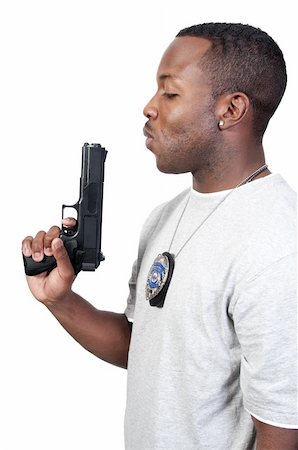 simsearch:400-04816325,k - A black African American police detective man on the job with a gun Stock Photo - Budget Royalty-Free & Subscription, Code: 400-04311770