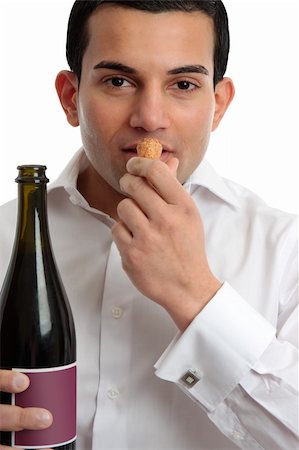 simsearch:400-04313696,k - A man or wine steward sniffing the cork from wine.  White background. Photographie de stock - Aubaine LD & Abonnement, Code: 400-04312049
