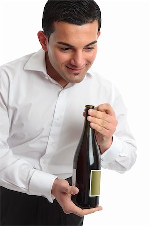 simsearch:400-04313696,k - A waiter or servant presenting a bottle of wine.  White background. Photographie de stock - Aubaine LD & Abonnement, Code: 400-04312051