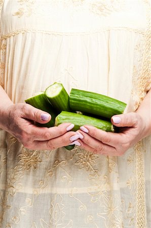 pictures old lady lost - Housewife holding bunch of cucumbers Stock Photo - Budget Royalty-Free & Subscription, Code: 400-04312168