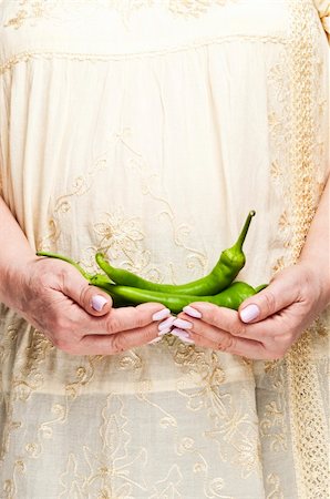 fuzzbones (artist) - Housewife holding bunch of green pepper Stock Photo - Budget Royalty-Free & Subscription, Code: 400-04312175