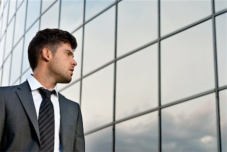 simsearch:400-04631810,k - Young businessman looking good expectations on modern building background Stock Photo - Budget Royalty-Free & Subscription, Code: 400-04312446