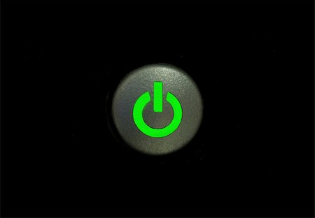 simsearch:400-04868914,k - A power button signified by a green LED showing that a piece of electronic equipment is on Foto de stock - Royalty-Free Super Valor e Assinatura, Número: 400-04312545