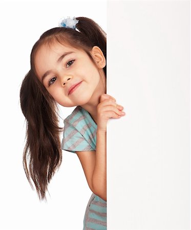 simsearch:400-04364119,k - Smiling little girl holding empty white board Fotografie stock - Microstock e Abbonamento, Codice: 400-04313480