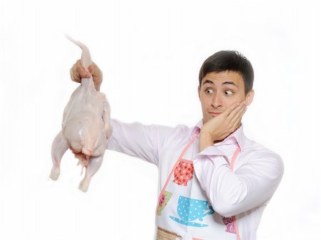 raw chicken dishes - Handsome young man holding chicken preparing to cook romantic dinner. isolated on white background Stock Photo - Budget Royalty-Free & Subscription, Code: 400-04313879
