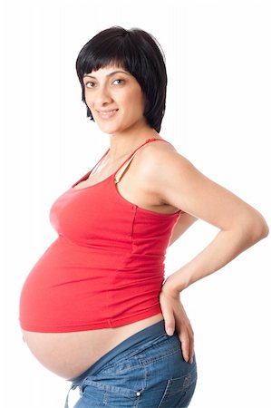 simsearch:400-04334843,k - Smiling pregnant woman isolated over white background Foto de stock - Royalty-Free Super Valor e Assinatura, Número: 400-04324197