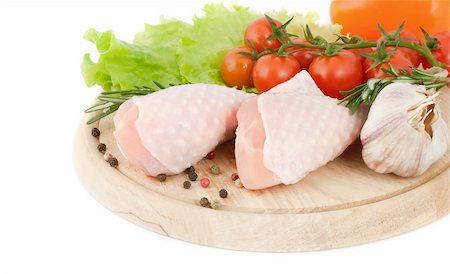 raw chicken on cutting board - Chicken drumsticks with vegetables on the cutting board Stock Photo - Budget Royalty-Free & Subscription, Code: 400-04324192