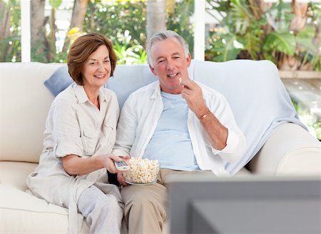 simsearch:400-04311095,k - Seniors watching tv at home Stock Photo - Budget Royalty-Free & Subscription, Code: 400-04324357