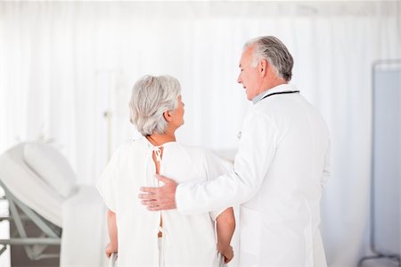 Doctor helping his patient to walk Stock Photo - Budget Royalty-Free & Subscription, Code: 400-04324472