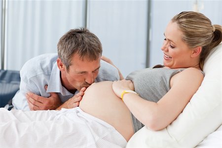 picture of pregnant women in hospital with husband - Man kissing his wife's belly Stock Photo - Budget Royalty-Free & Subscription, Code: 400-04324706