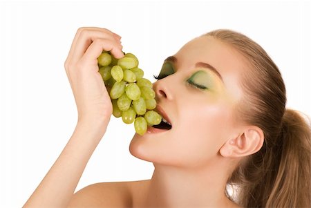 Pretty young woman with grape closeup on the white background Stock Photo - Budget Royalty-Free & Subscription, Code: 400-04325771