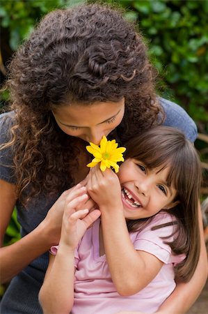 Mother smelling a flower with her daughter Stock Photo - Budget Royalty-Free & Subscription, Code: 400-04326046