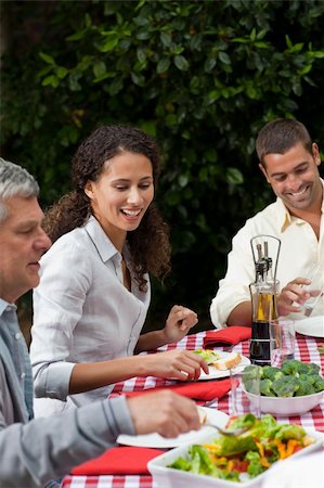 Happy family eating in the garden Stock Photo - Budget Royalty-Free & Subscription, Code: 400-04326056