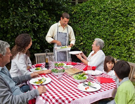 simsearch:400-04327229,k - Man serving his family at the table Stock Photo - Budget Royalty-Free & Subscription, Code: 400-04326062