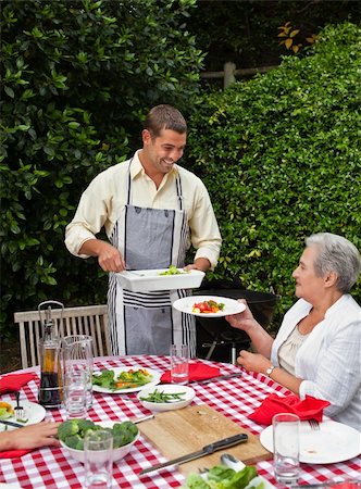 simsearch:400-04327229,k - Man serving his family at the table Stock Photo - Budget Royalty-Free & Subscription, Code: 400-04326063