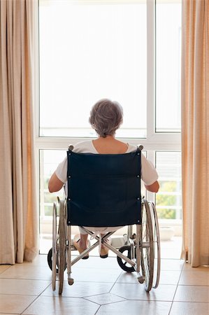 simsearch:400-04327098,k - Mature woman in her wheelchair with her back to the camera Stock Photo - Budget Royalty-Free & Subscription, Code: 400-04326183