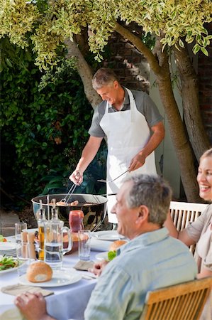 simsearch:400-04327229,k - Family eating in the garden Stock Photo - Budget Royalty-Free & Subscription, Code: 400-04326355